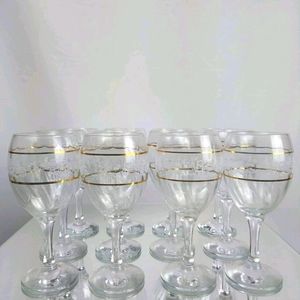 12  Crystal Drinking Glasses. 8w/Gold trim 4 w/o